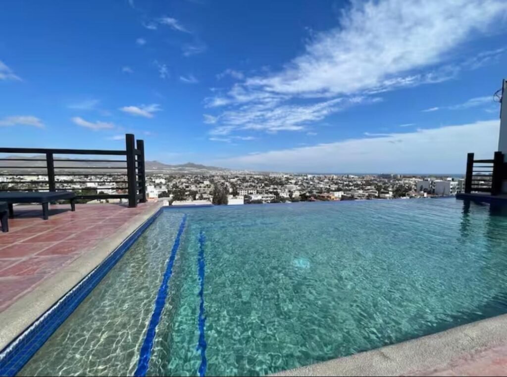Los Cabos Idaho Condos Bright, spacious 2-bed, 2-bath condo, freshly updated with paint, updated cabinets, and quartz countertops. This stylish, move-in-ready home features a private patio just steps from a beautifully landscaped pool, plus access to the shared rooftop terrace with sweeping ocean – 1921 C. 8 De Octubre, Cabo San Lucas, BS